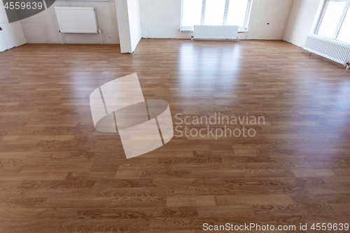 Image of Laminate flooring in the interior of a spacious room in a new building