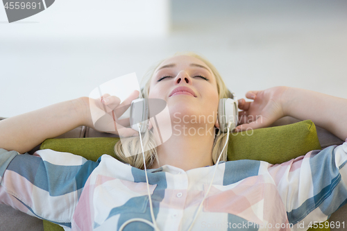 Image of girl enjoying music through headphones