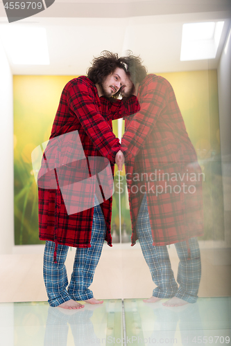 Image of portrait of young man in bathrobe