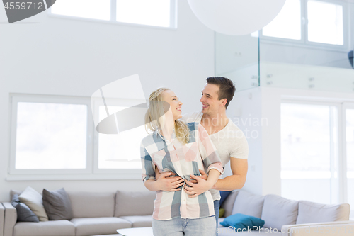 Image of couple hugging in their new home