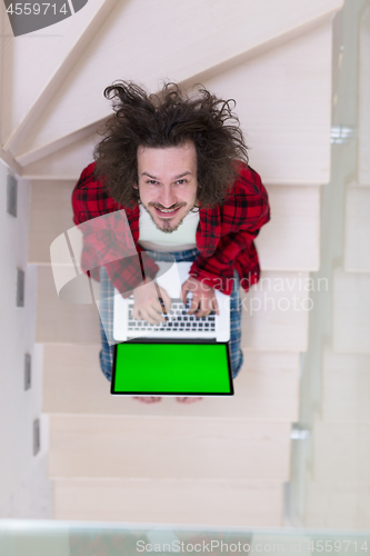 Image of freelancer in bathrobe working from home