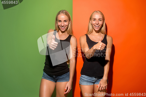 Image of The happy business women standing and smiling