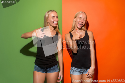 Image of The happy business women standing and smiling