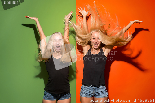 Image of The happy business women standing and smiling