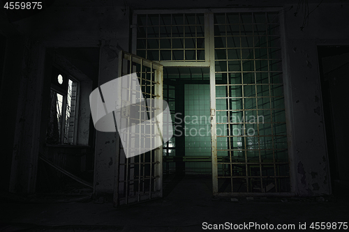 Image of Old abandoned prison cell in the dark