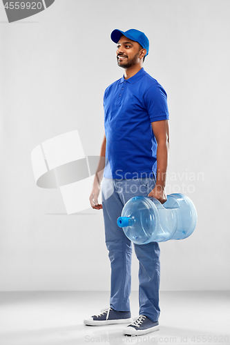 Image of happy indian delivery man with water barrel