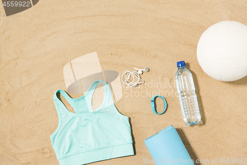 Image of sports top, mat, fitness tracker and water bottle