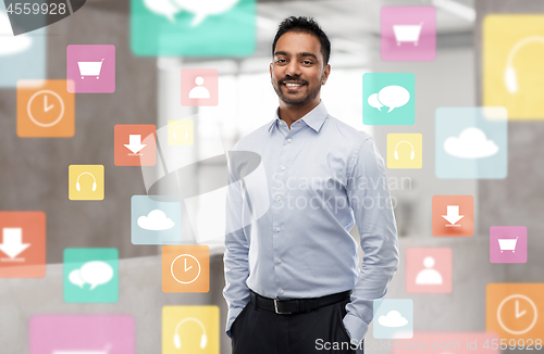 Image of indian businessman with app icons at office