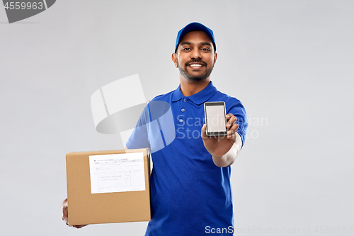 Image of indian delivery man with smartphone and parcel box