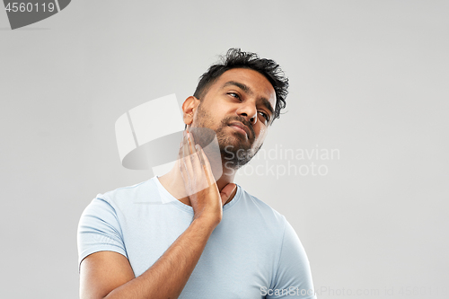 Image of indian man suffering from sore glands or tonsils