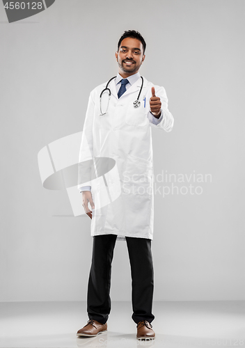 Image of smiling indian male doctor showing thumbs up