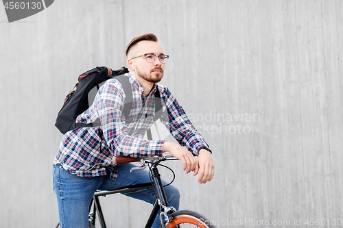 Image of hipster man with fixed gear bike and backpack