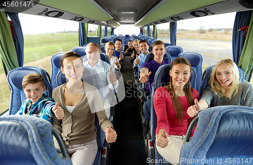 Image of group of happy passengers travelling by bus