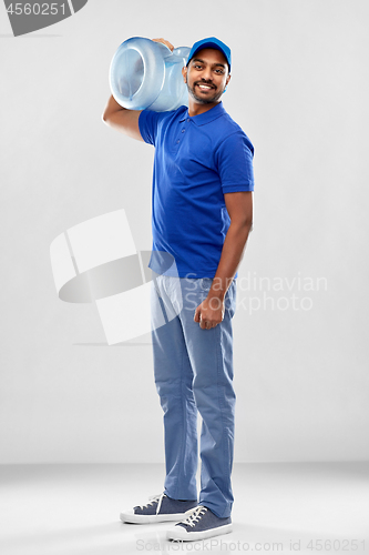 Image of happy indian delivery man with water barrel