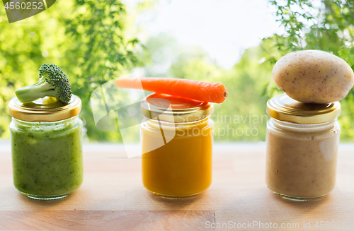 Image of vegetable puree or baby food in glass jars