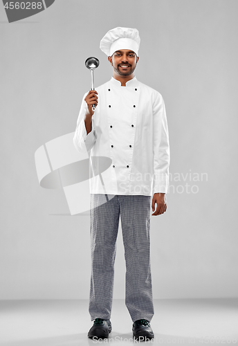 Image of happy male indian chef in toque with ladle