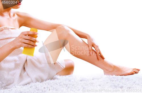 Image of woman applying cream