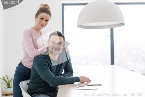 Image of couple hugging in their new home