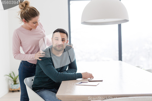 Image of couple hugging in their new home