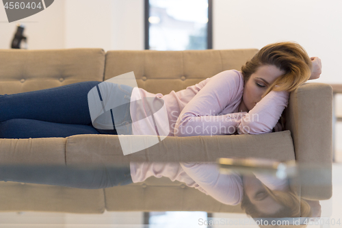 Image of Woman Sleeping On Sofa