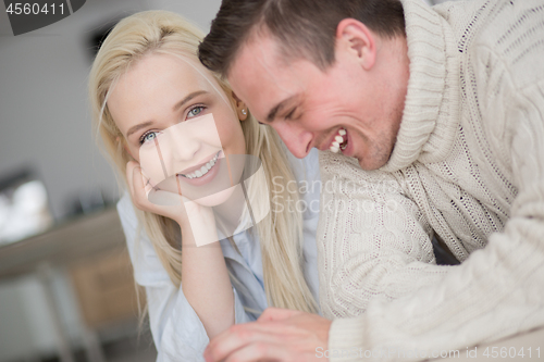 Image of Young Couple using digital tablet on cold winter day