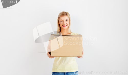 Image of happy woman holding cardboard box