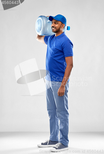 Image of happy indian delivery man with water barrel