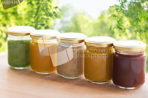 Image of vegetable or fruit puree or baby food in jars