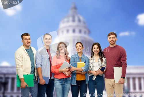 Image of group of smiling students over capitol building