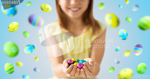 Image of close up of girl holding chocolate easter eggs