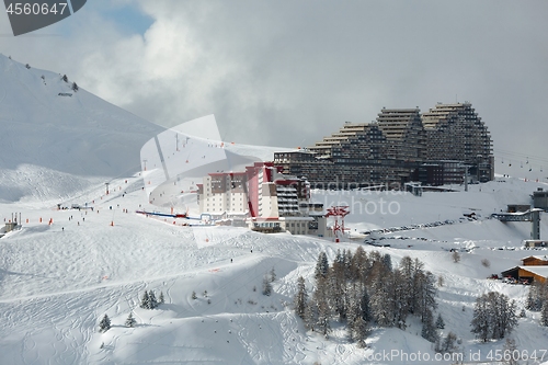 Image of Skiing slopes, with many people