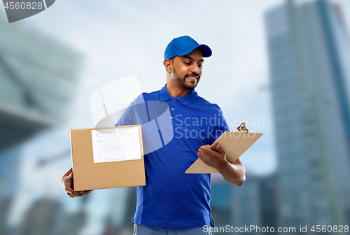 Image of indian delivery man with parcel box and clipboard