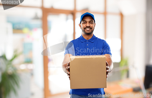 Image of indian delivery man with parcel box at office