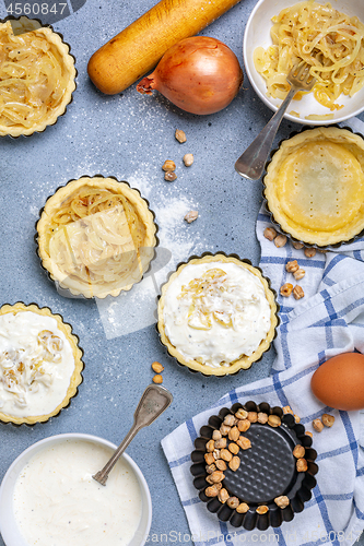 Image of Cooking onion mini pies.