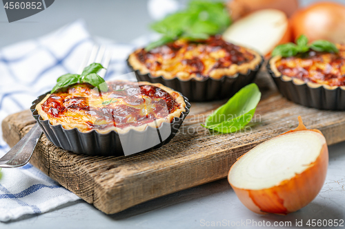 Image of Homemade onion open mini pies.