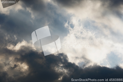 Image of Stormy sky with sunlight at sunset