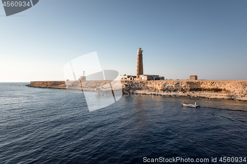 Image of Tall lighthouse on the sea