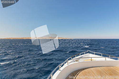 Image of Boat heading towards the horizon