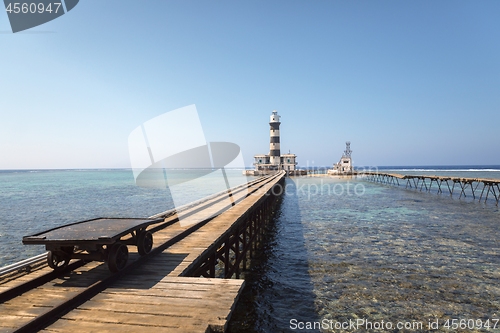 Image of Long wooden piel leading into the sea