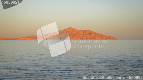 Image of land over the horizon under blue sky