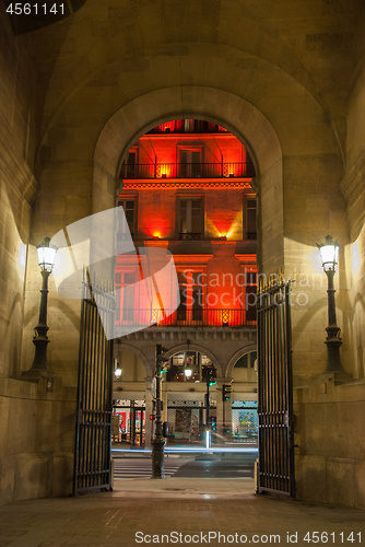 Image of Paris, France - August 04, 2006: The arch to the Vivienne Gallery is an illuminated street lamp a tourist attraction of Paris in France.