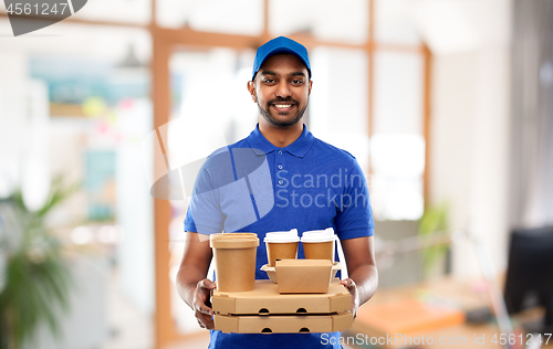 Image of indian delivery man with food and drinks at office