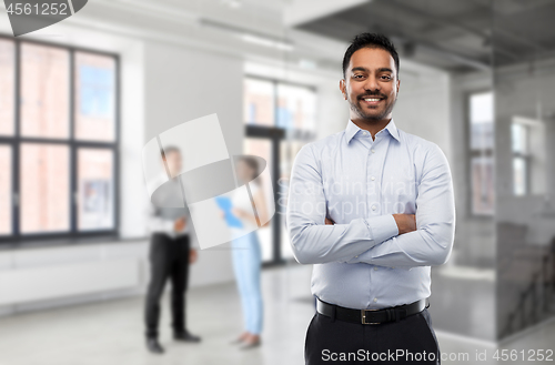 Image of indian businessman or realtor in empty office room