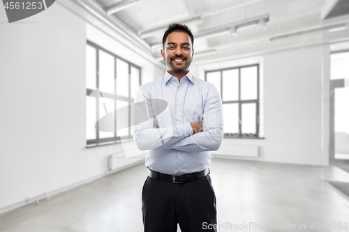 Image of indian businessman or realtor in empty office room