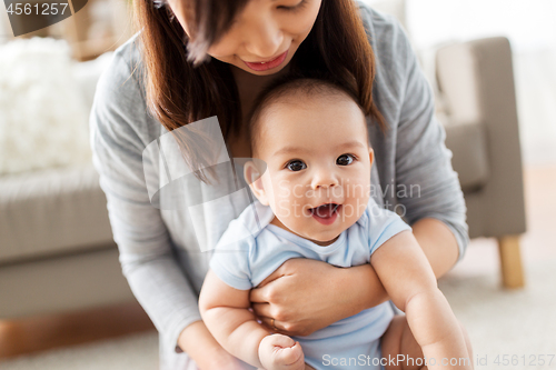 Image of close up of mother with little baby at home