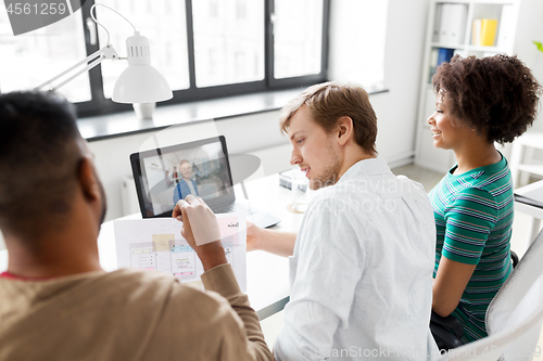 Image of creative team having video conference at office