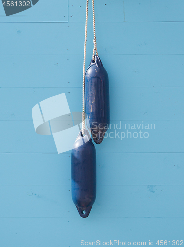 Image of BLue buoy hanging out to dry