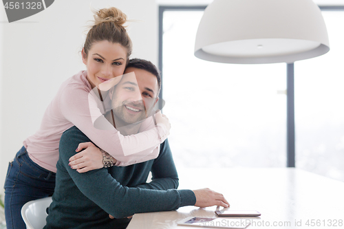 Image of couple hugging in their new home