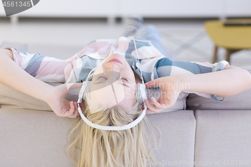 Image of girl enjoying music through headphones