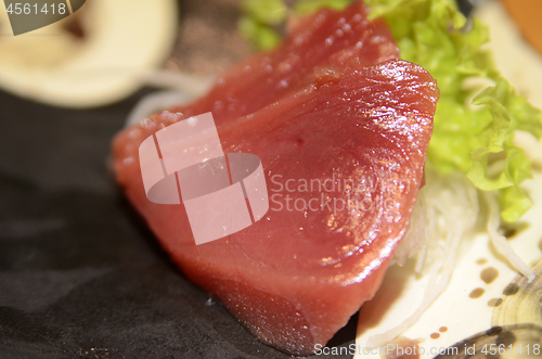 Image of Tuna sashimi cutting raw blue fin tuna